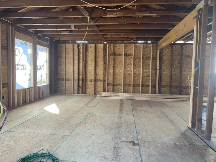Room stripped to the studs with new framing